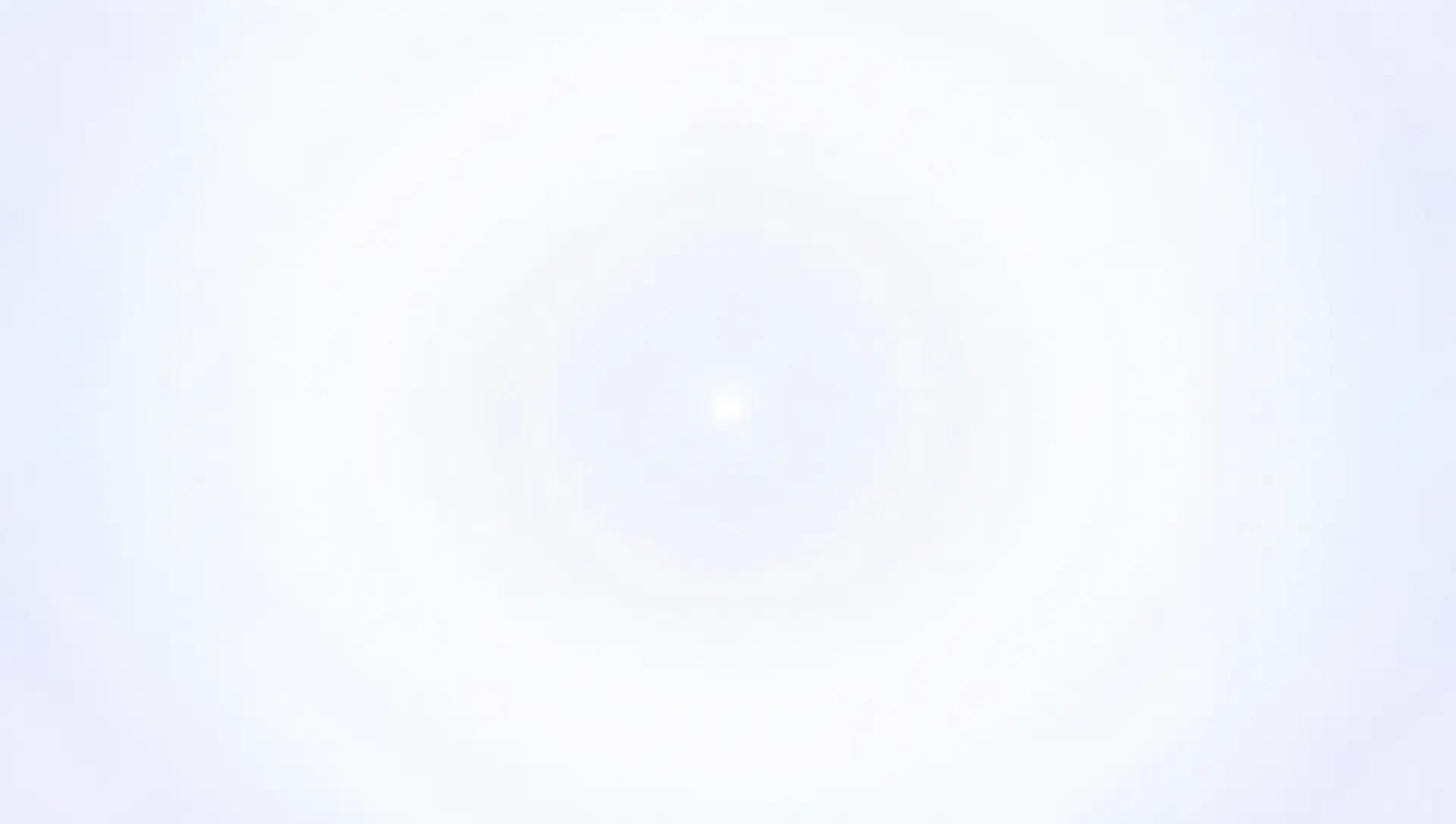 An almost white field of light with a faint bright point at its centre.